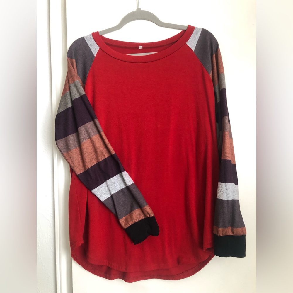 Red shirt with fall colored long sleeved shirt